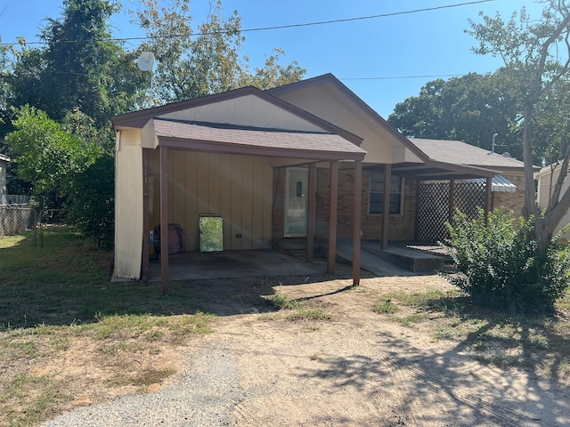 exterior space featuring a carport