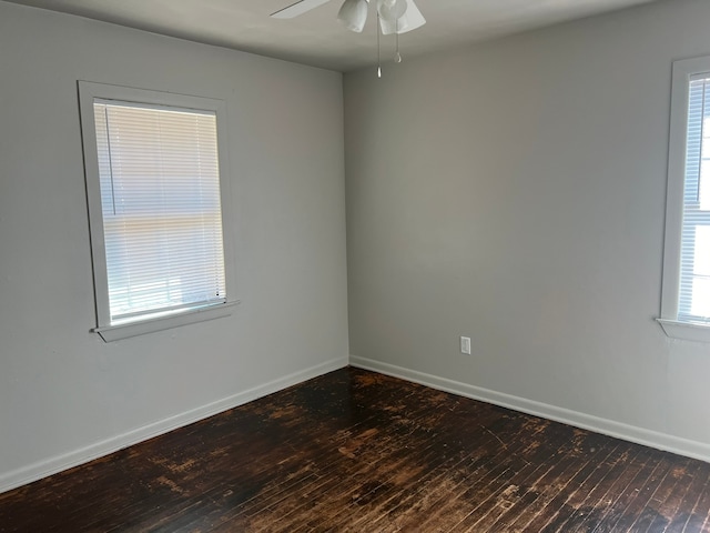 unfurnished room featuring dark hardwood / wood-style flooring and ceiling fan