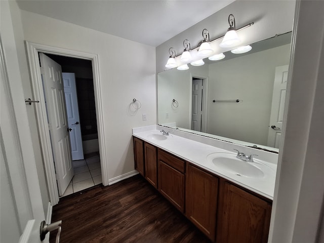 bathroom featuring wood-type flooring and vanity