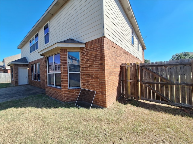 view of property exterior with a yard