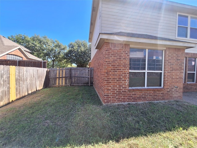 view of property exterior with a lawn