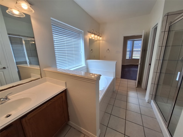 bathroom featuring tile patterned floors, independent shower and bath, and vanity