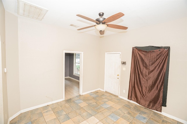 423 W Pembroke Ave, Dallas, TX 75208 - spare room with a ceiling fan and baseboards