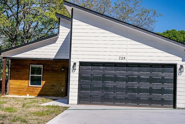 garage featuring wood walls