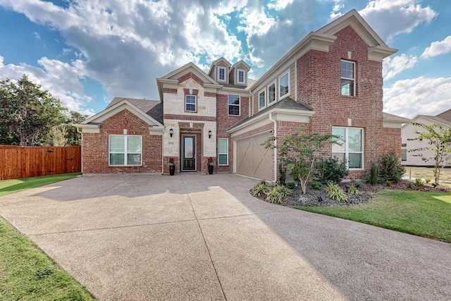 view of front of property with a garage and a front lawn