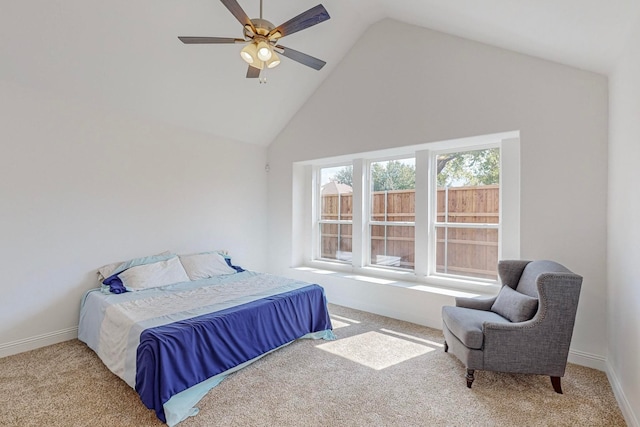 bedroom featuring ceiling fan, high vaulted ceiling, and light carpet