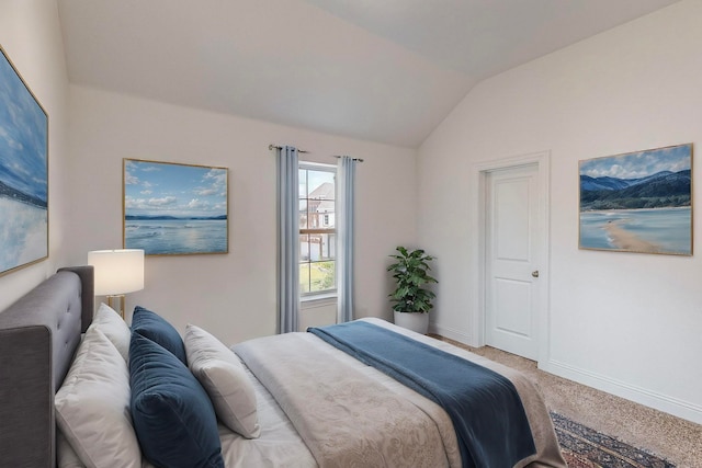 carpeted bedroom featuring vaulted ceiling