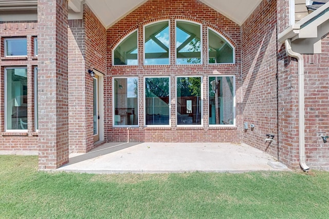 entrance to property featuring a patio area