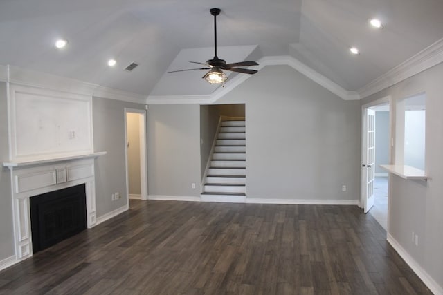 unfurnished living room featuring dark hardwood / wood-style floors, ceiling fan, crown molding, and vaulted ceiling