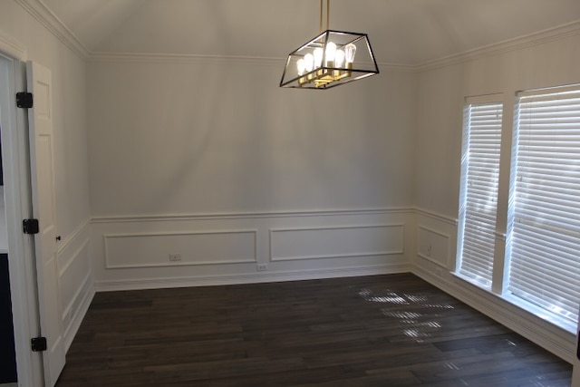 unfurnished dining area featuring dark hardwood / wood-style floors, lofted ceiling, crown molding, and a chandelier