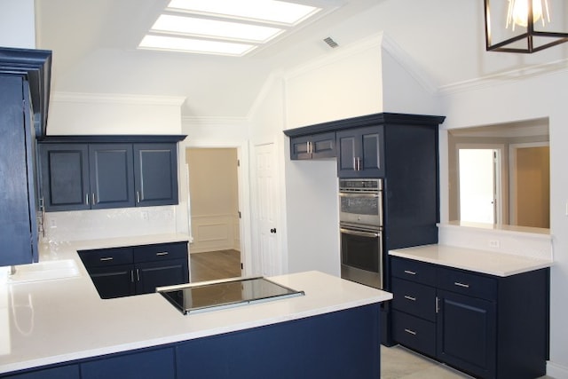 kitchen featuring vaulted ceiling, kitchen peninsula, double oven, and black cooktop