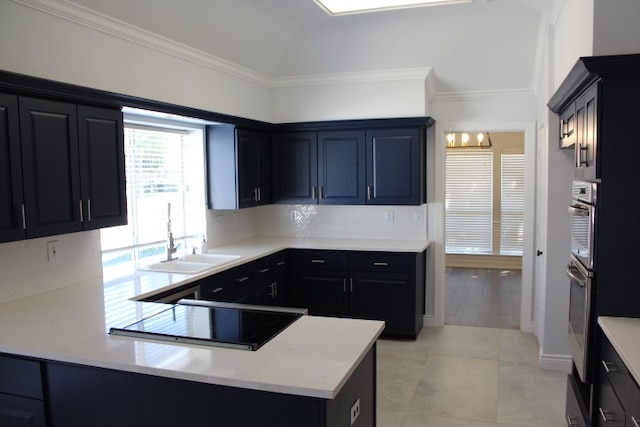 kitchen featuring sink, oven, light hardwood / wood-style floors, and ornamental molding