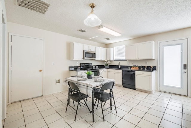 kitchen featuring sink, black appliances, decorative light fixtures, white cabinets, and light tile patterned flooring