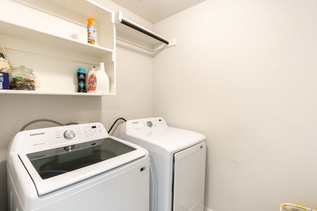 washroom featuring washer and clothes dryer