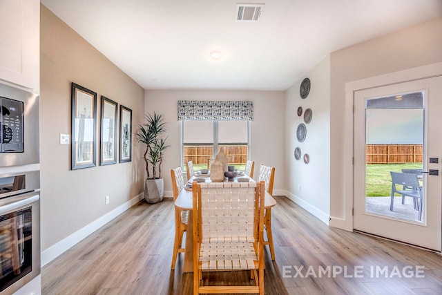 dining room with light wood-type flooring