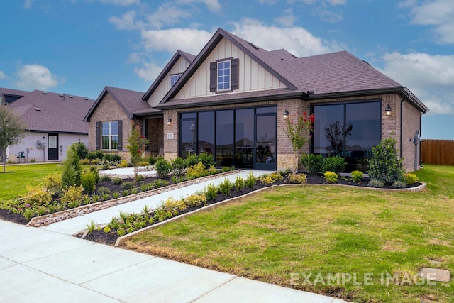 craftsman-style house with a front lawn