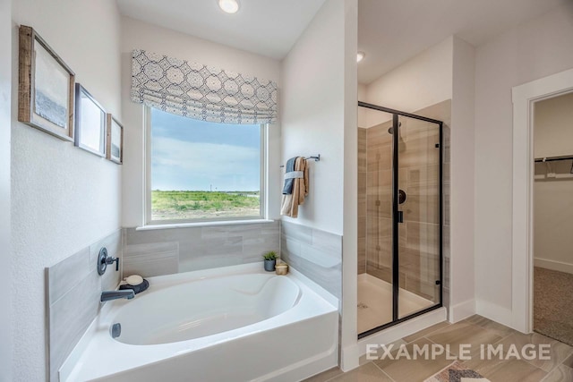 bathroom with hardwood / wood-style floors and separate shower and tub