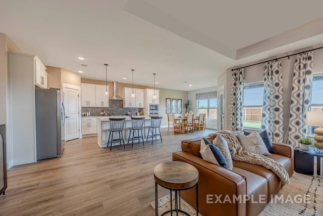 living room with light hardwood / wood-style floors