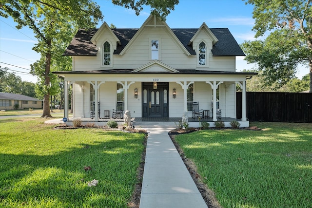 view of front of home featuring a front lawn and a porch