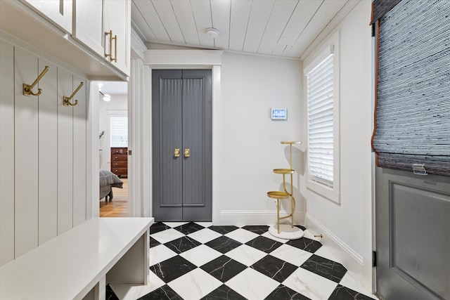 mudroom featuring wood ceiling, lofted ceiling, and a wealth of natural light