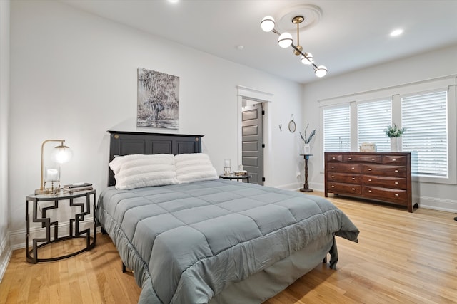 bedroom with light hardwood / wood-style floors