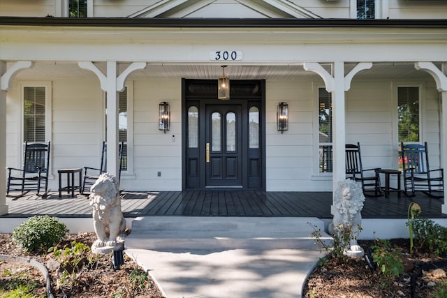 property entrance featuring a porch