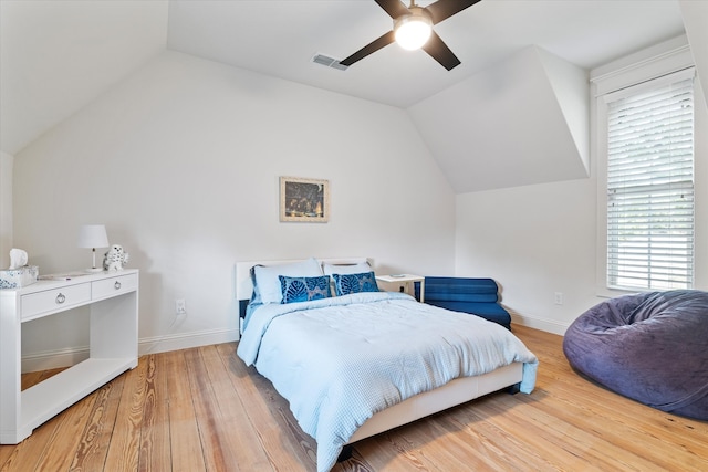 bedroom featuring ceiling fan, vaulted ceiling, and hardwood / wood-style floors