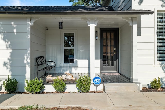 doorway to property featuring a porch