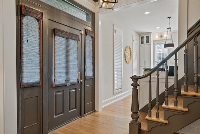 foyer entrance with light hardwood / wood-style flooring