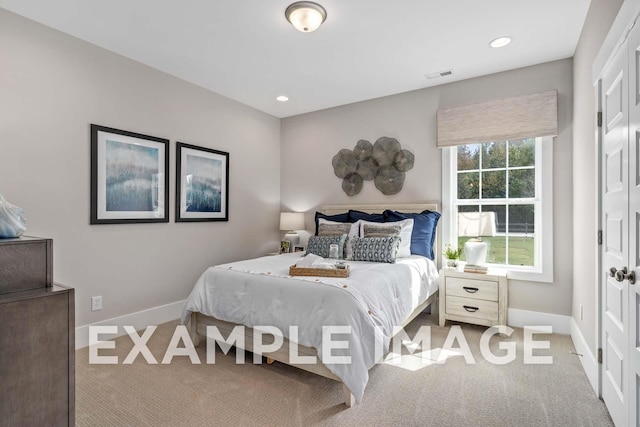 bedroom with recessed lighting, light colored carpet, visible vents, and baseboards