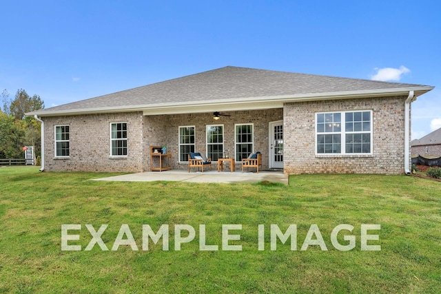 back of property featuring ceiling fan, brick siding, a patio, and a lawn