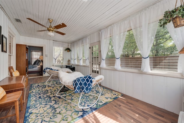 sunroom / solarium with wooden ceiling and ceiling fan