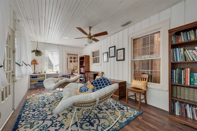 living room with ceiling fan, wooden ceiling, and dark hardwood / wood-style flooring