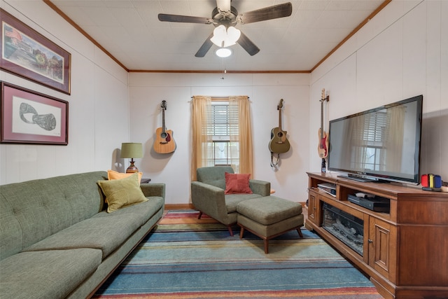 living room featuring ceiling fan and crown molding