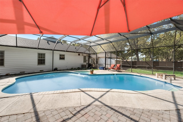 view of swimming pool featuring glass enclosure, cooling unit, an in ground hot tub, and a patio