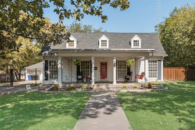 view of front of house featuring covered porch and a front yard