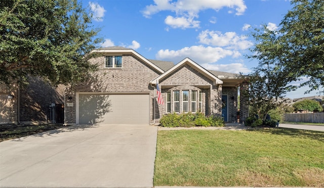 view of front of property with a front yard and a garage