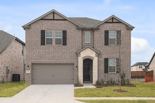 view of front facade with cooling unit, a garage, and a front yard