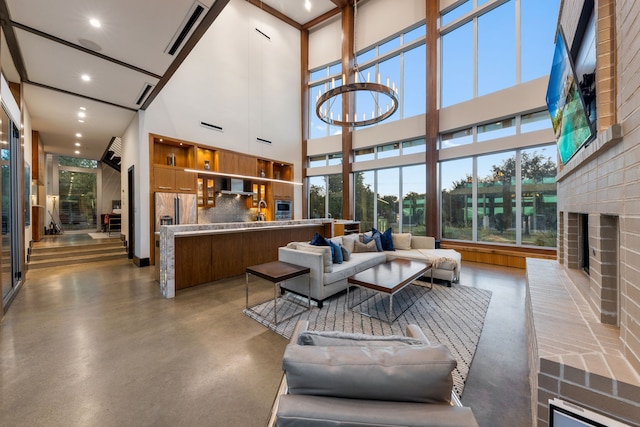 10150 Marsh Ln, Dallas, TX 75229 - living room featuring a fireplace, recessed lighting, concrete floors, and a towering ceiling