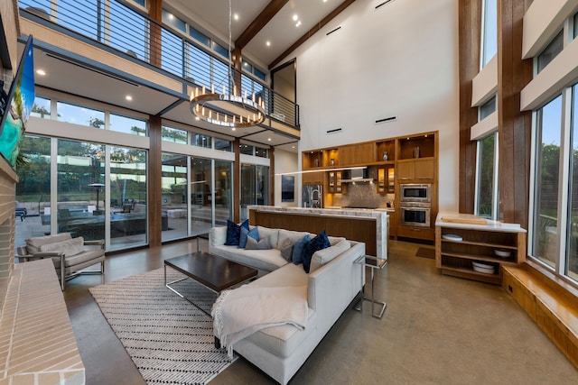 10150 Marsh Ln, Dallas, TX 75229 - living room featuring finished concrete flooring, a wealth of natural light, and a towering ceiling