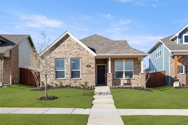 craftsman-style house featuring a front lawn