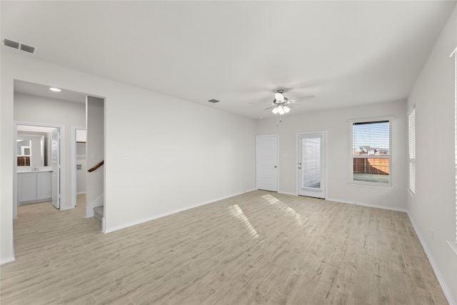 unfurnished room featuring ceiling fan and light wood-type flooring