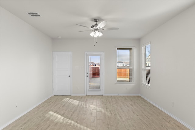 unfurnished room featuring ceiling fan and light wood-type flooring