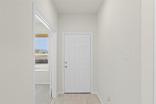 doorway with light hardwood / wood-style flooring