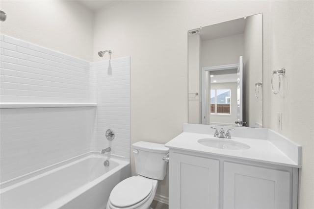 full bathroom featuring washtub / shower combination, toilet, and vanity