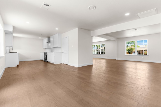 unfurnished living room featuring light hardwood / wood-style flooring