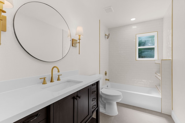 full bathroom featuring toilet, vanity, tiled shower / bath, and tile patterned flooring