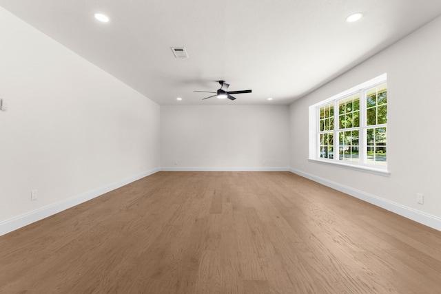 unfurnished room with ceiling fan and light wood-type flooring