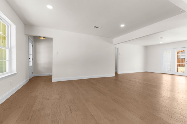 spare room with wood-type flooring