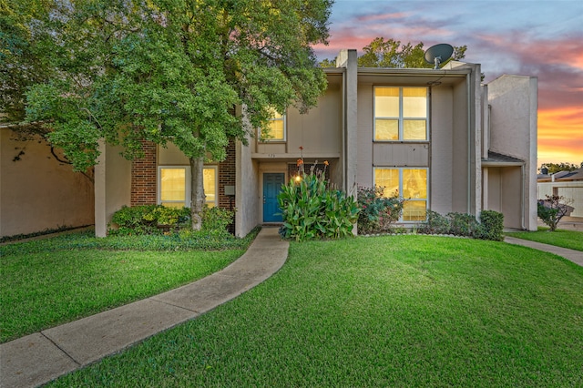 view of front of house with a yard